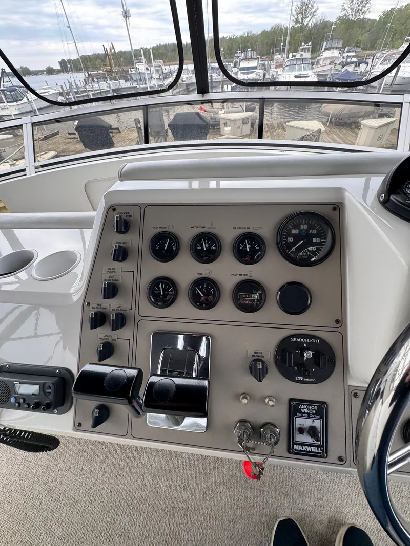 Slide: The Image of 1999 Carver 406 Aft Cabin Yacht dashboard at marina. - 21