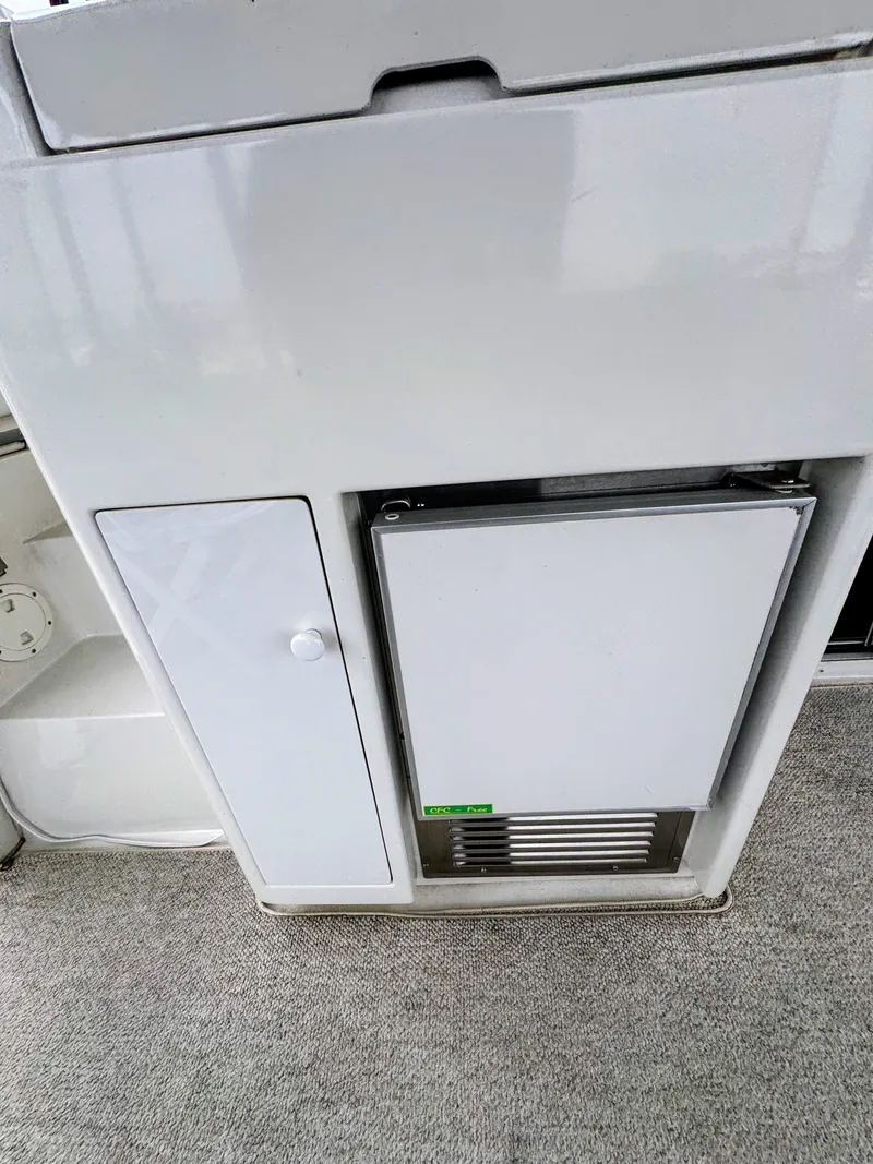 Slide: The Image of Interior of 1999 Carver 406 Yacht with refrigerator. - 27