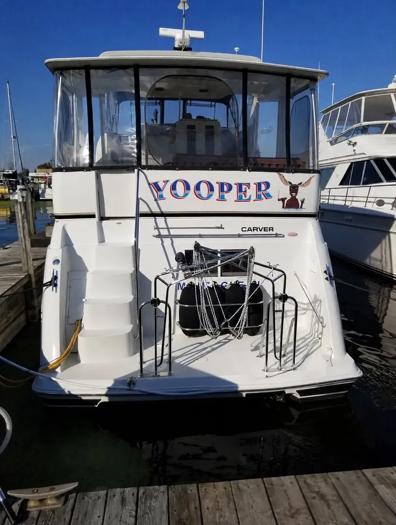 Slide: The Image of 1999 Carver 406 Aft Cabin Motor Yacht docked in marina. - 3