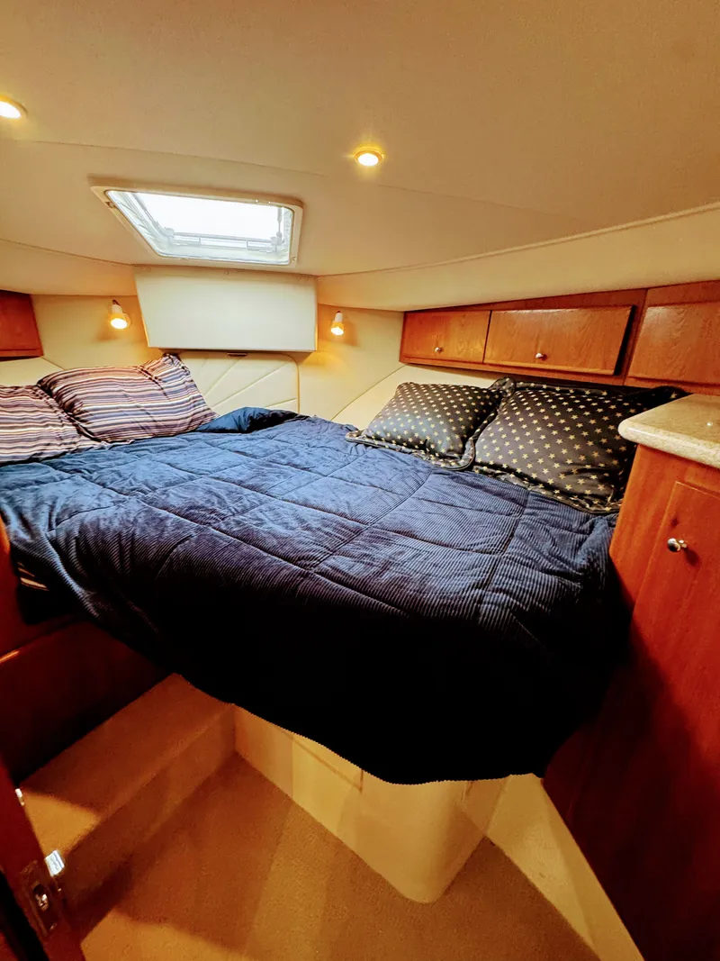 Slide: The Image of Interior of Carver 406 Aft Cabin Yacht, cozy bedroom with double bed. - 36