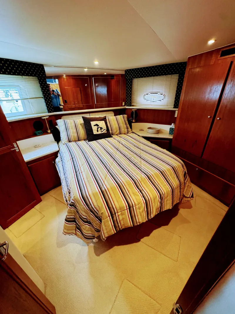 Slide: The Image of Interior of Carver 406 Yacht featuring cozy bedroom. - 45