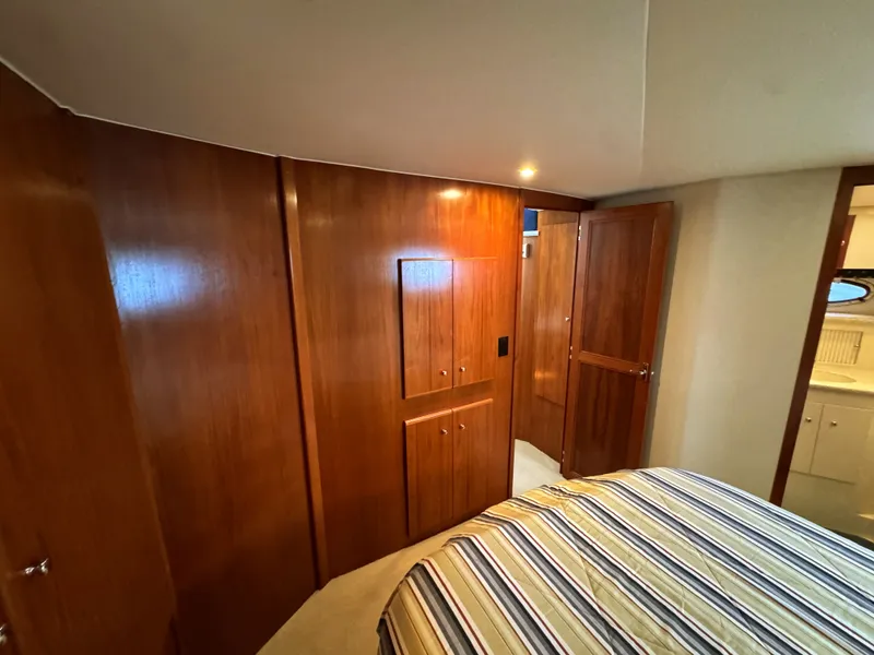 Slide: The Image of Interior of 1999 Carver 406 Yacht with wooden cabinetry. - 47