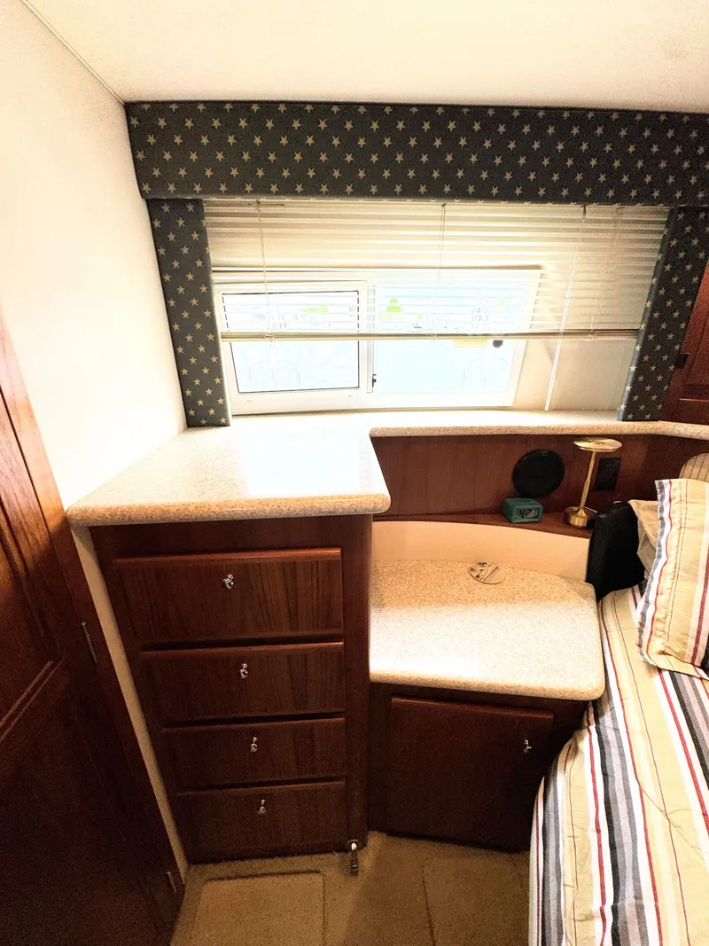 Slide: The Image of Interior of 1999 Carver 406 Yacht with cabinets and window. - 48