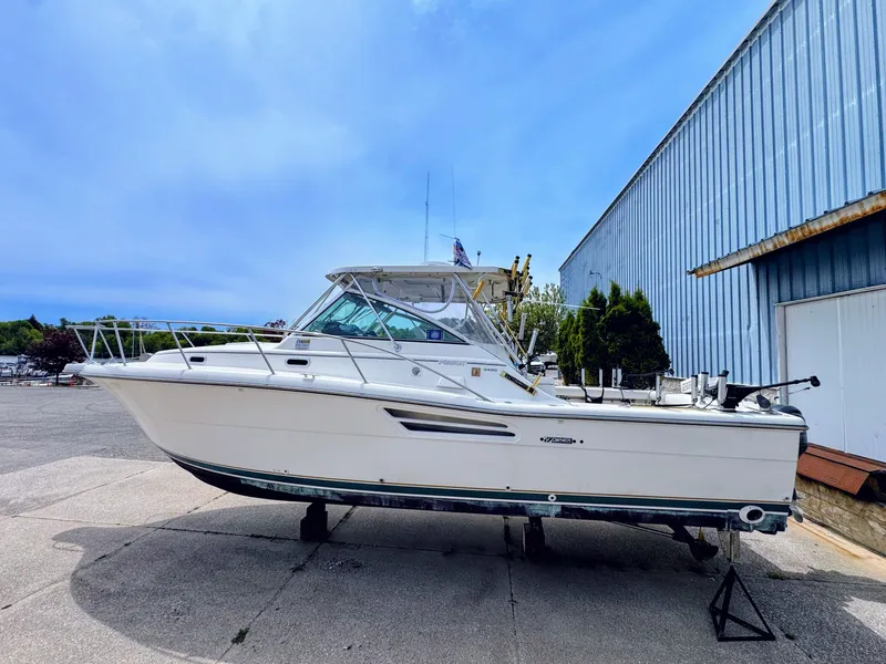 Slide: The Image of 1999 Pursuit 3400 Express boat on a dry dock. - 1