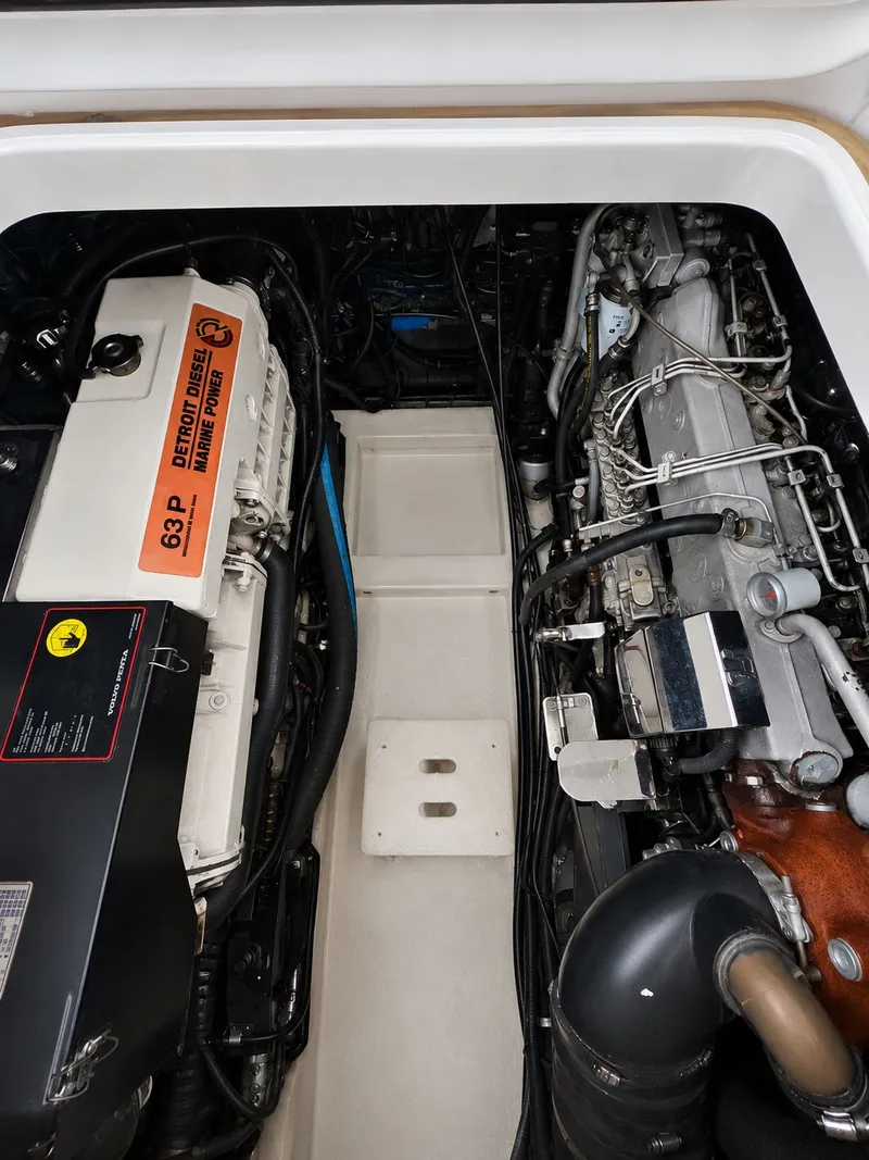 Slide: The Image of Engine compartment of a 1999 Pursuit 3400 Express boat with Detroit Diesel engine. - 21