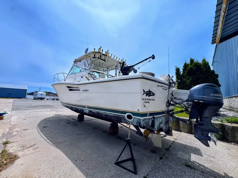 Slide: The Image of 1999 Pursuit 3400 Express boat on a dry dock. - 4