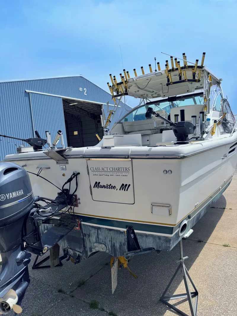 Slide: The Image of 1999 Pursuit 3400 Express boat at shipyard, Manistee, MI. - 7