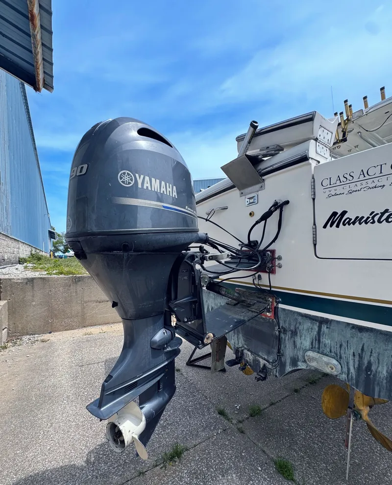 Slide: The Image of 1999 Pursuit 3400 Express with Yamaha outboard motor. - 8