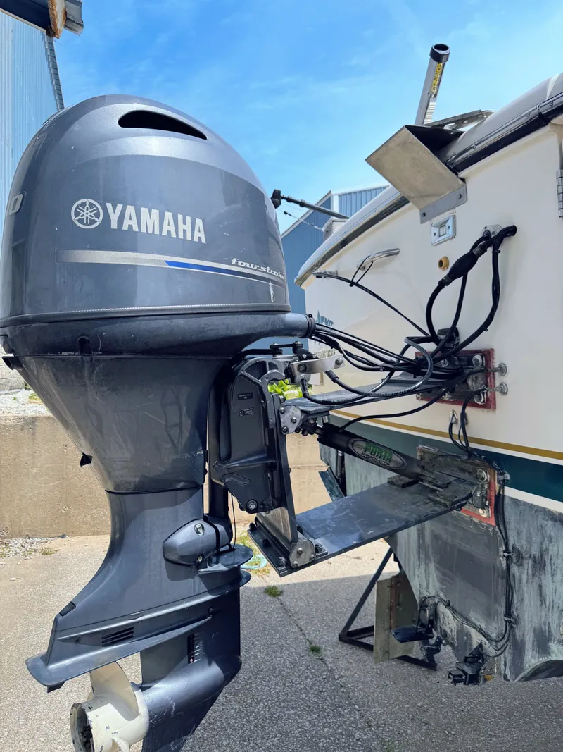 Slide: The Image of Yamaha outboard motor on a 1999 Pursuit 3400 Express boat. - 9