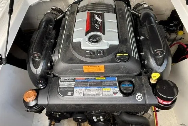 Slide: The Image of 2021 Chaparral 21 SSi boat engine, featuring a Mercury 4.5L 200 horsepower motor. - 10