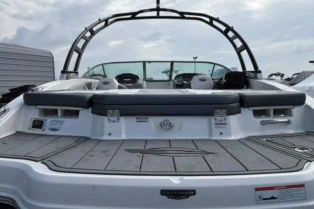 Slide: The Image of 2021 Chaparral 21 SSi boat, rear view with seating and wakeboard tower. - 12