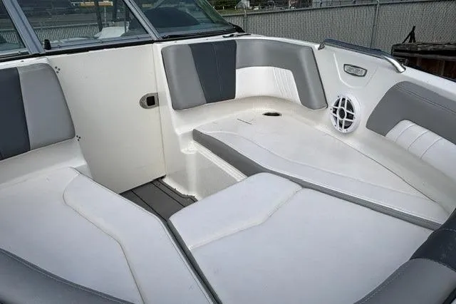 Slide: The Image of Interior view of a 2021 Chaparral 21 SSi boat with gray and white seating. - 13