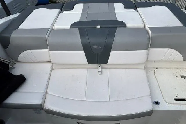 Slide: The Image of 2021 Chaparral 21 SSi boat seat, featuring gray and white cushioned upholstery. - 14