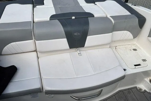 Slide: The Image of 2021 Chaparral 21 SSi boat seating area with gray and white upholstery. - 15
