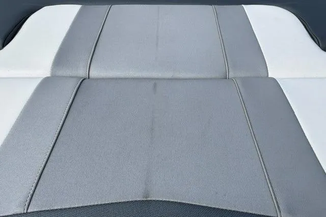Slide: The Image of 2021 Chaparral 21 SSi boat seat with gray and white upholstery design. - 16