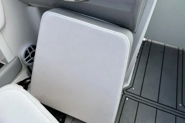 Slide: The Image of Chaparral 21 SSi 2021 boat interior with cushioned seating and speaker. - 18