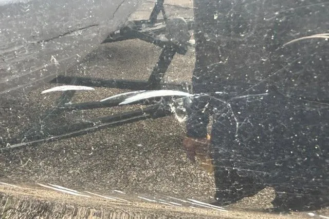 Slide: The Image of Scratched surface on 2021 Chaparral 21 SSi boat hull, showing wear and damage. - 21