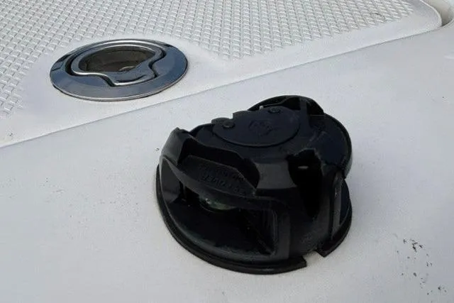 Slide: The Image of 2021 Chaparral 21 SSi boat deck with black cleat and circular hatch. - 25