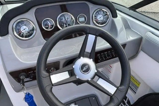 Slide: The Image of Dashboard of 2021 Chaparral 21 SSi boat with steering wheel and gauges. - 3