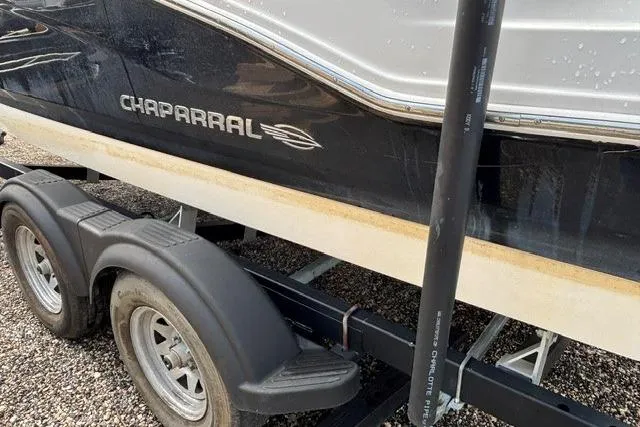 Slide: The Image of Chaparral 21 SSi 2021 boat on trailer, side view with logo visible. - 36