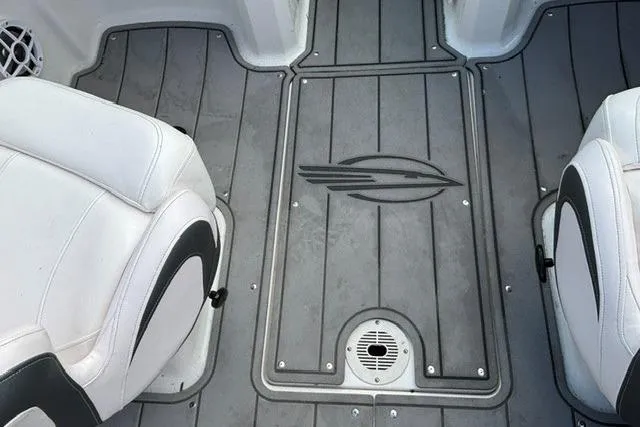 Slide: The Image of Interior view of 2021 Chaparral 21 SSi boat with gray flooring and white seats. - 37