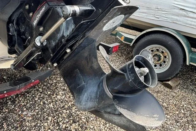 Slide: The Image of 2021 Chaparral 21 SSi boat propeller and trailer on gravel surface. - 40