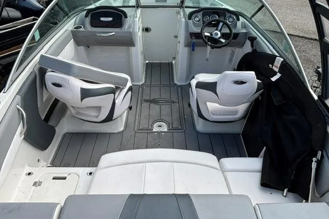 Slide: The Image of Interior of a 2021 Chaparral 21 SSi boat with modern seating and dashboard. - 7