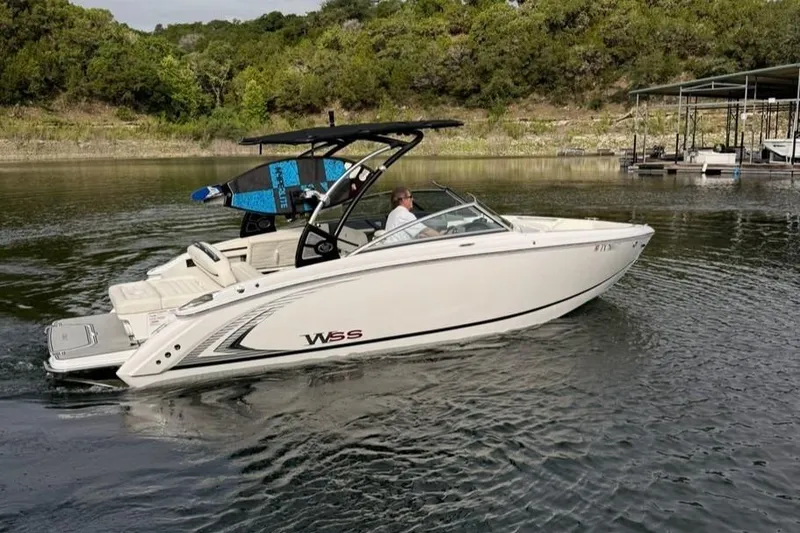 Slide: The Image of 2018 Cobalt R5 WSS Surf boat cruising on a calm lake. - 13