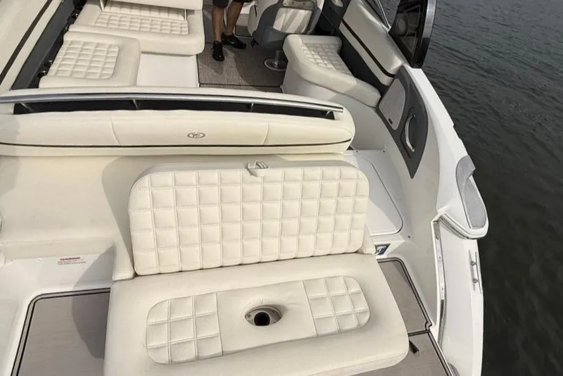 Slide: The Image of 2018 Cobalt R5 WSS Surf boat interior with white cushioned seating. - 22