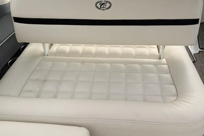 Slide: The Image of White leather seating in a 2018 Cobalt R5 WSS Surf boat, featuring quilted design. - 24