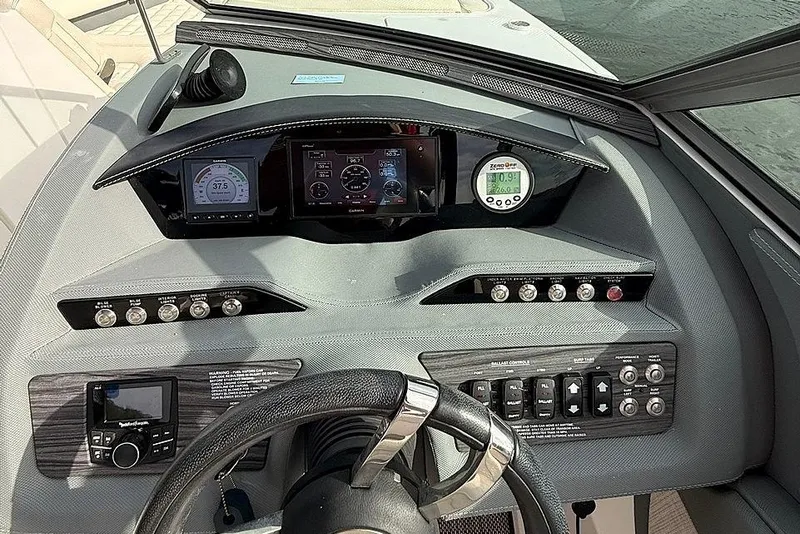 Slide: The Image of Dashboard of a 2018 Cobalt R5 WSS Surf boat with modern controls and displays. - 26