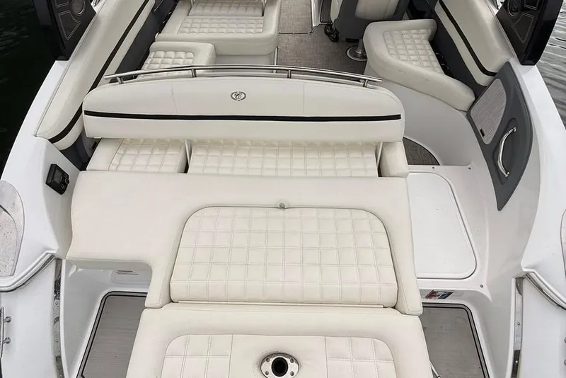 Slide: The Image of 2018 Cobalt R5 WSS Surf boat interior with white cushioned seating. - 3