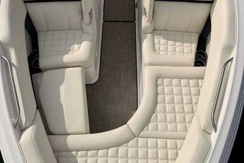 Slide: The Image of Luxurious interior of a 2018 Cobalt R5 WSS Surf boat with white quilted seating. - 34