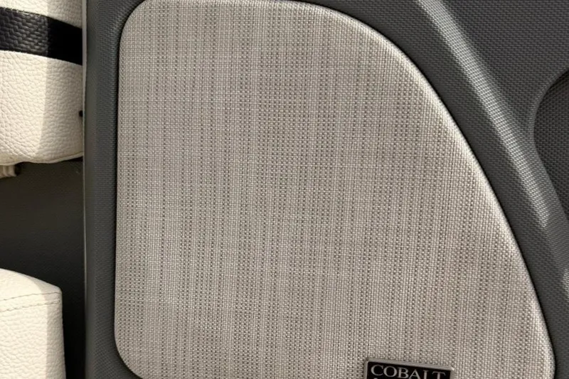 Slide: The Image of Interior detail of 2018 Cobalt R5 WSS Surf boat with textured panel and logo. - 39