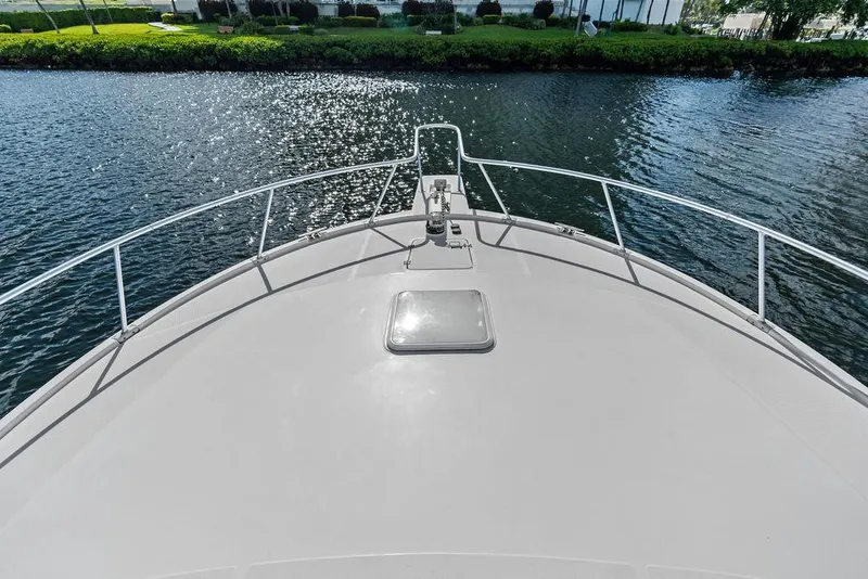 Slide: The Image of Bow view of 2005 Luhrs 38 Convertible yacht on calm water. - 28