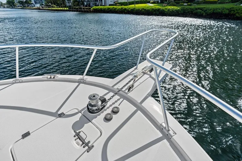 Slide: The Image of Bow of 2005 Luhrs 38 Convertible yacht on sparkling water. - 29