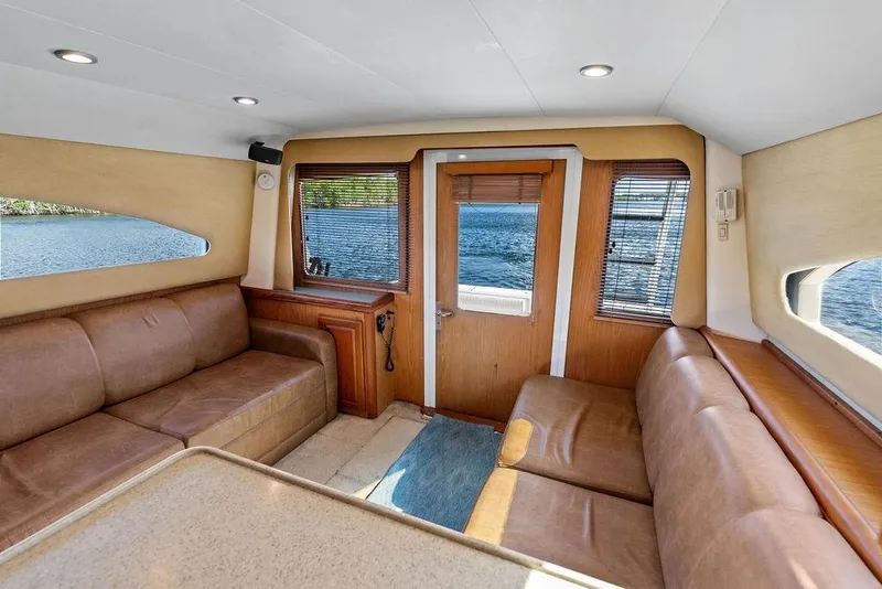 Slide: The Image of Interior of 2005 Luhrs 38 Convertible yacht with leather seating and water view. - 37