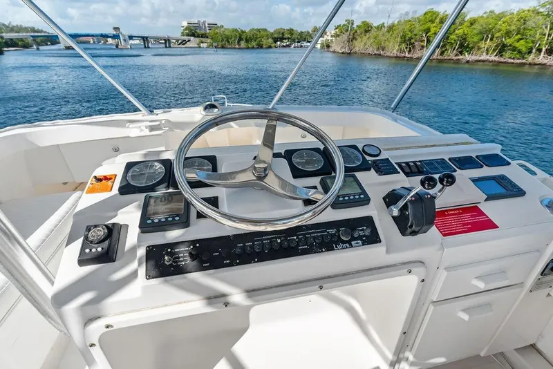 Slide: The Image of Helm of 2005 Luhrs 38 Convertible yacht with steering wheel and control panel. - 41