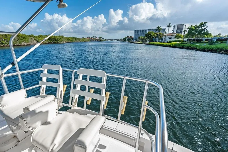 Slide: The Image of 2005 Luhrs 38 Convertible yacht deck overlooking scenic waterway and lush shoreline. - 43