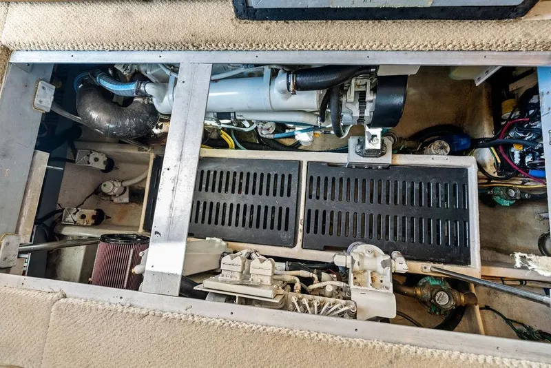 Slide: The Image of Engine compartment of a 2005 Luhrs 38 Convertible boat, showcasing mechanical components. - 44