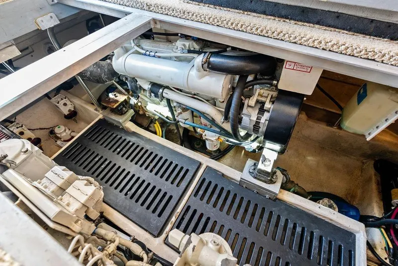 Slide: The Image of Engine compartment of 2005 Luhrs 38 Convertible boat, showcasing mechanical components and layout. - 45