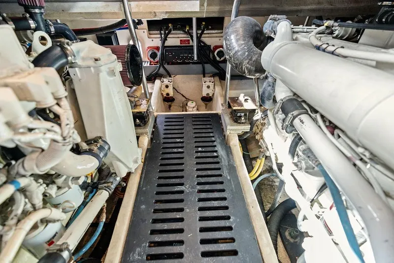 Slide: The Image of Engine room of 2005 Luhrs 38 Convertible boat, showcasing mechanical components and layout. - 49
