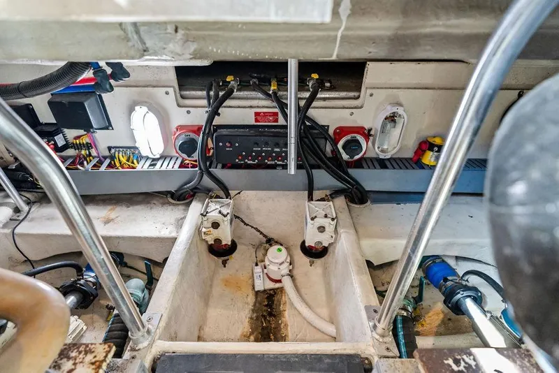 Slide: The Image of Engine room of 2005 Luhrs 38 Convertible boat, showcasing wiring and mechanical components. - 50