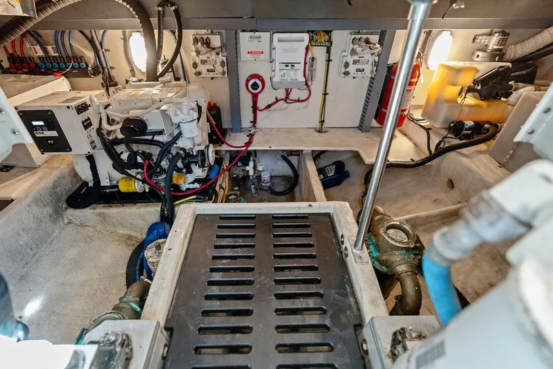 Slide: The Image of Engine room of 2005 Luhrs 38 Convertible boat, showcasing mechanical and electrical systems. - 51