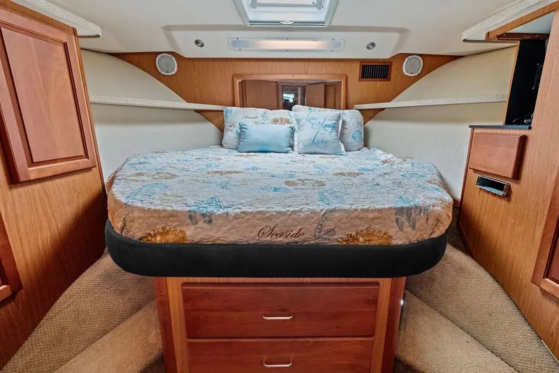 Slide: The Image of Luxurious cabin interior of 2005 Luhrs 38 Convertible yacht with cozy bedding. - 52