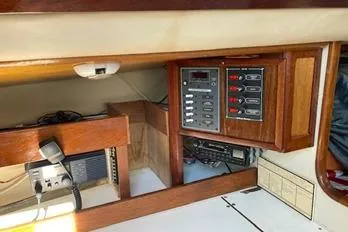 Slide: The Image of 1975 Carter 3/4 Ton boat interior with control panel and wooden cabinetry. - 19