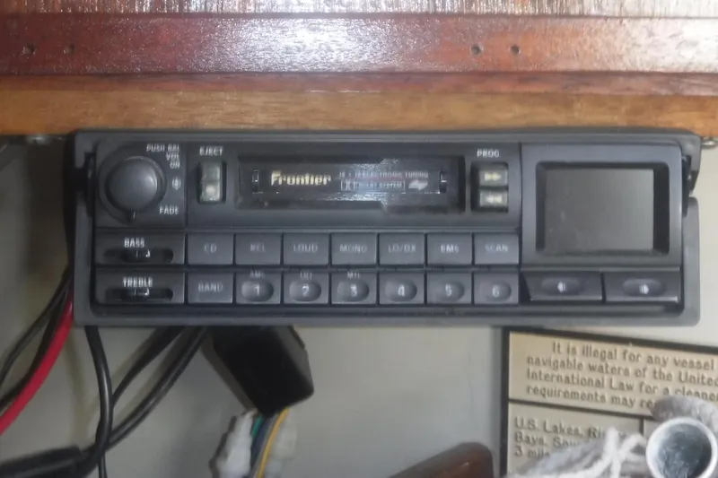 Slide: The Image of Vintage car stereo system in a 1975 Carter 3/4 Ton vehicle dashboard. - 21