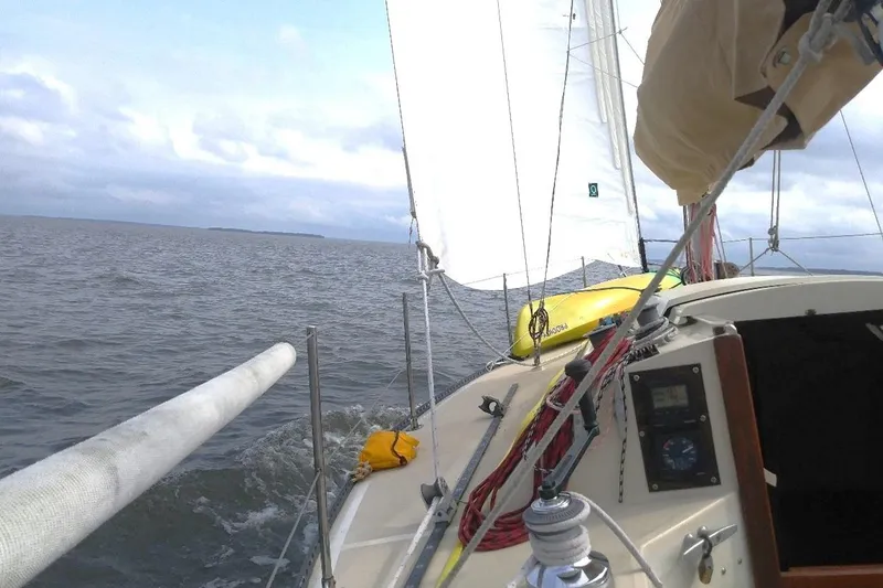 Slide: The Image of Sailing on a 1975 Carter 3/4 Ton yacht, open sea view, cloudy sky. - 8