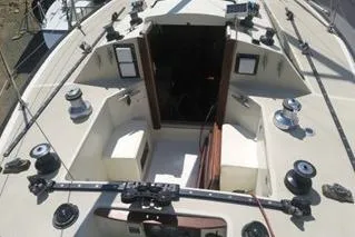 Slide: The Image of 1975 Carter 3/4 Ton sailboat cockpit with winches and open cabin entrance. - 9