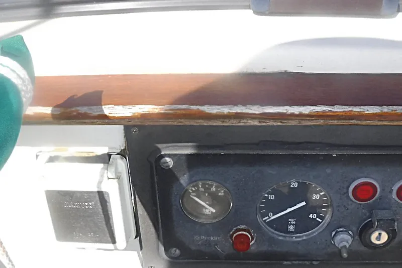 Slide: The Image of 1975 Carter 3/4 Ton dashboard with gauges and controls, featuring a Perkins engine panel. - 14